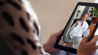 woman on tablet with doctor